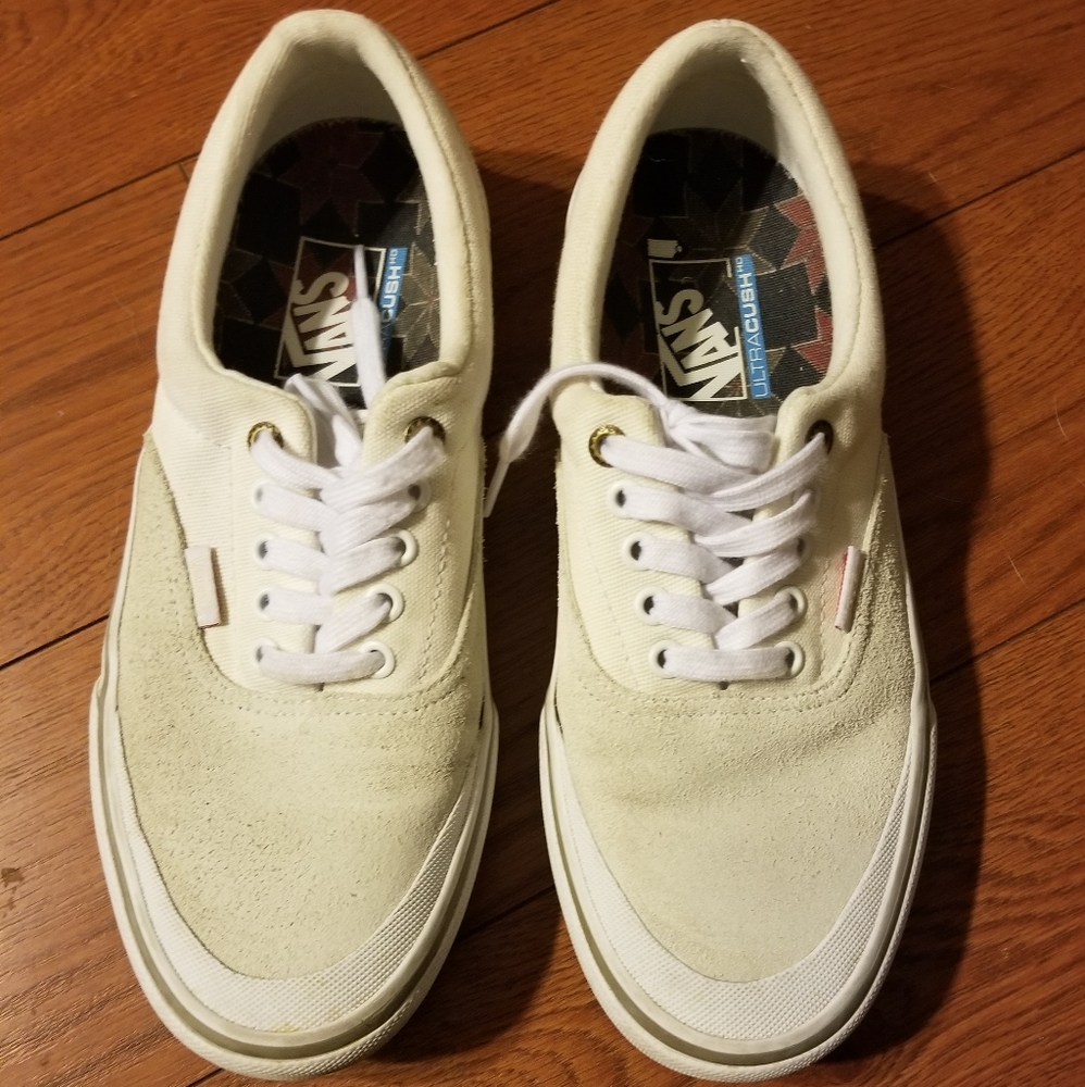 White canvas lace up Vans
